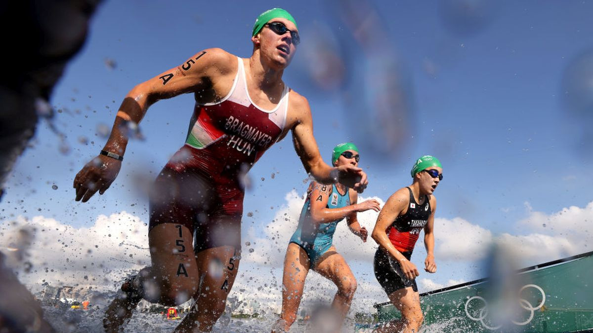 Athletes competing in the swimming stage in the Seine during the men's individual triathlon at the Paris 2024 Games. GETTY IMAGES