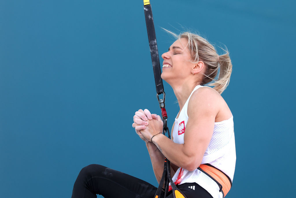 Aleksandra Miroslaw of Team Poland celebrates after their heat and setting a new world record. GETTY IMAGES