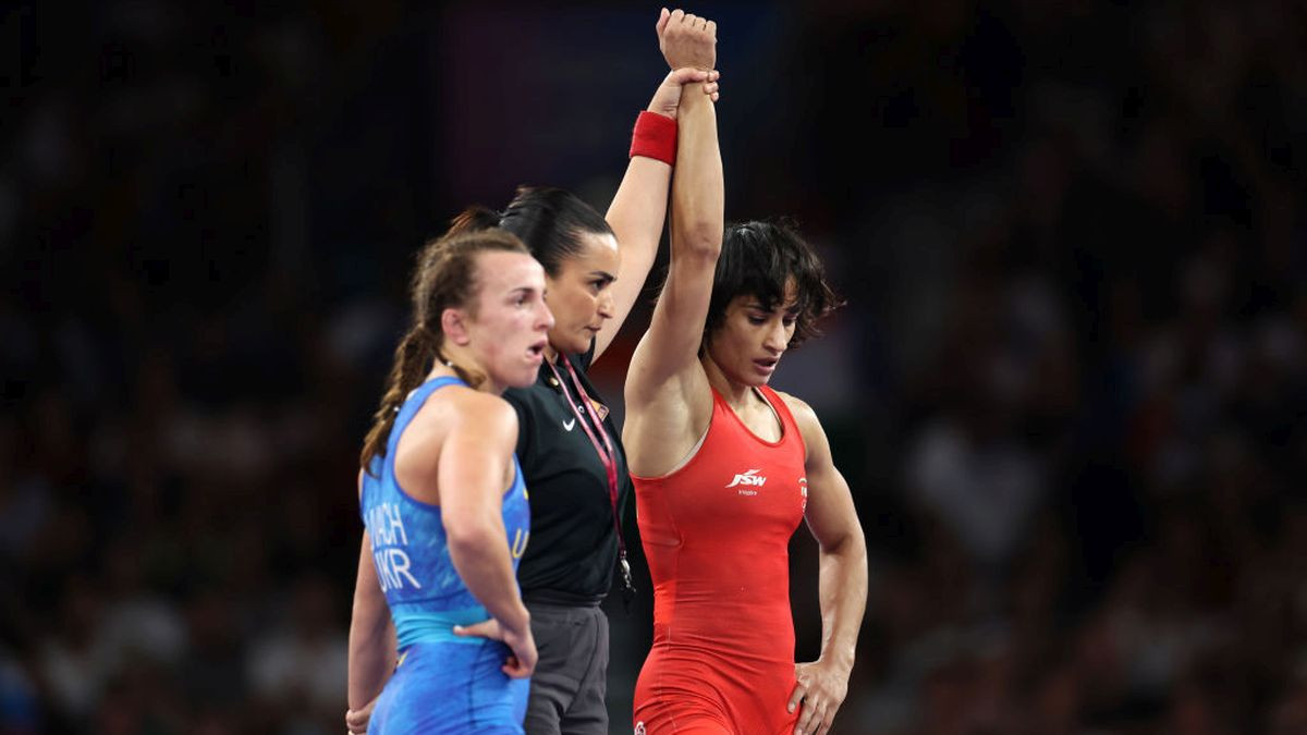 Vinesh of Team India and Oksana Livach of Team Ukraine react during the Women's Freestyle 50kg 1/4 Final. GETTY IMAGES