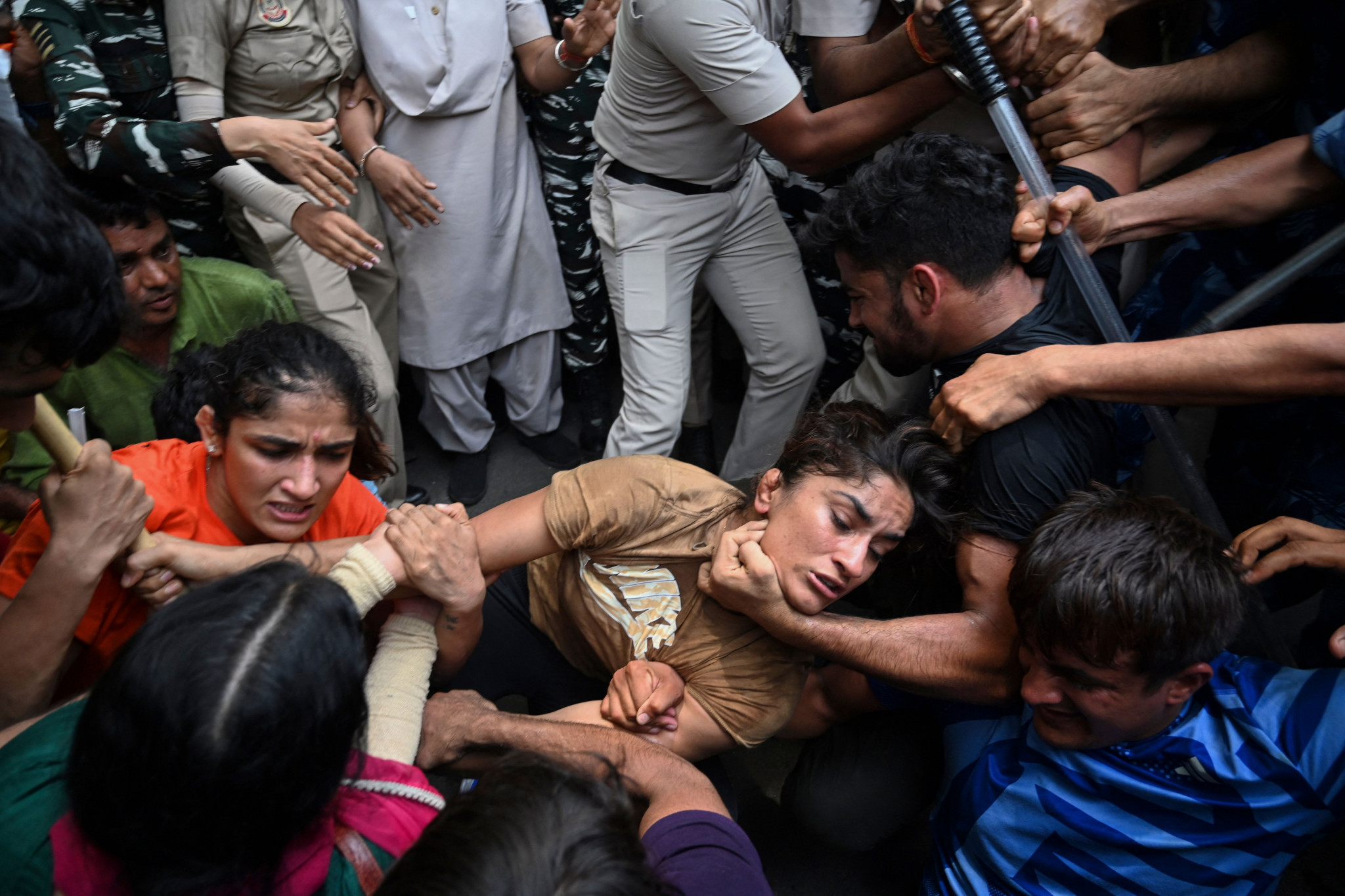 Vinesh Phogat is detained by the police while attempting to march to India's new parliament in New Delhi on May 28, 2023 during a protest against Brij Bhushan Singh. GETTY IMAGES 