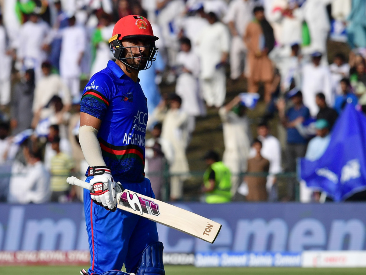 Afghan batsman Ihsanullah Janat leaves the pitch at the Asia Cup cricket match between Pakistan and Afghanistan at The Sheikh Zayed Stadium in Abu Dhabi. GETTY IMAGES