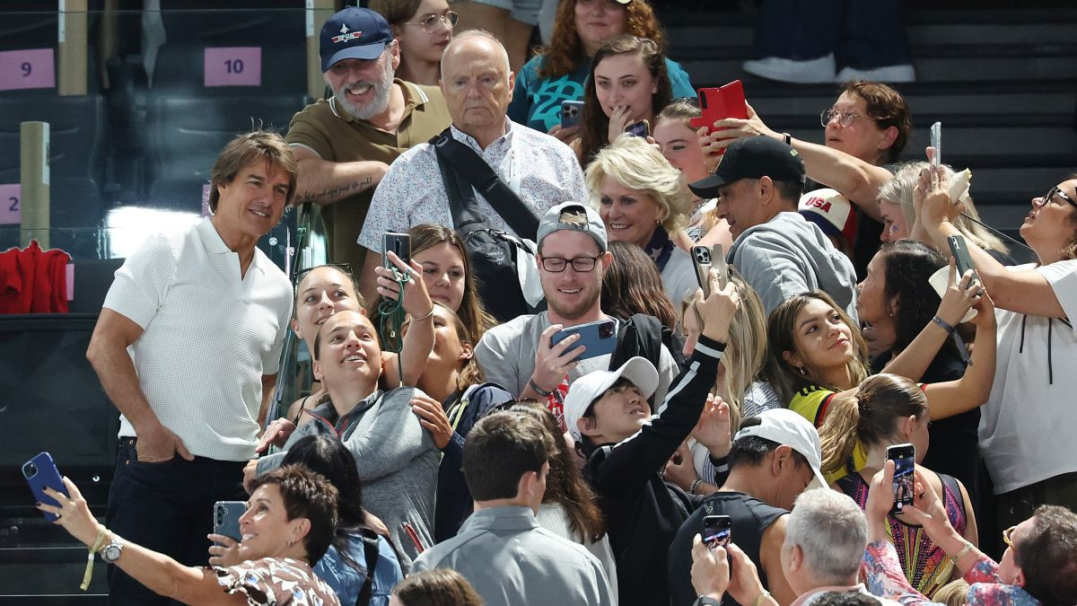 Tom Cruise poses for a selfie with fans during the Artistic Gymnastics Women's Qualification on day two of the Olympic Games Paris 2024 at Bercy Arena. GETTY IMAGES