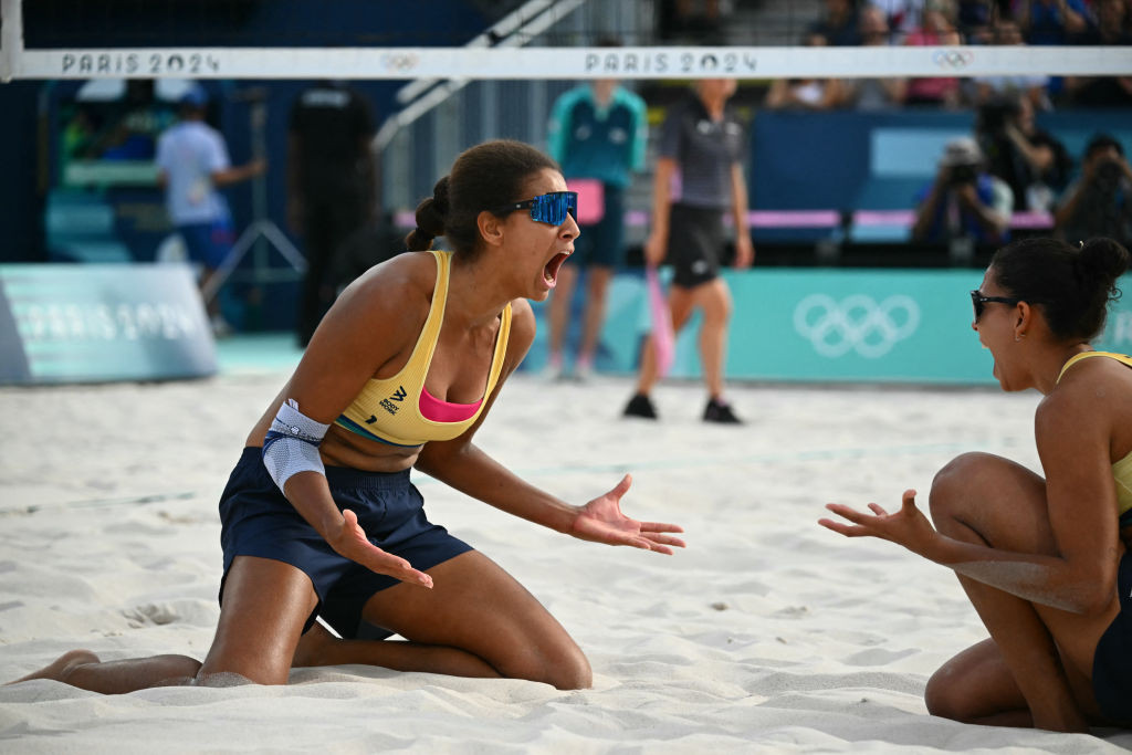 Brazil's Eduarda Santos Lisboa and Ana Patricia Silva Ramos celebrate their victory in the women's quarter-final. GETTY IMAGES