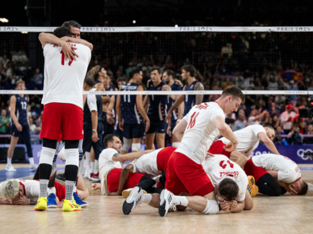 Polish players celebrate after wining the men's volleyball semi-final match GETTY IMAGES