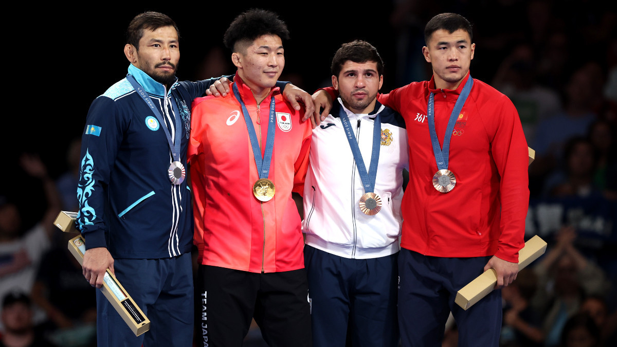 Four medallists of the Greco-Roman -77 kg category. GETTY IMAGES