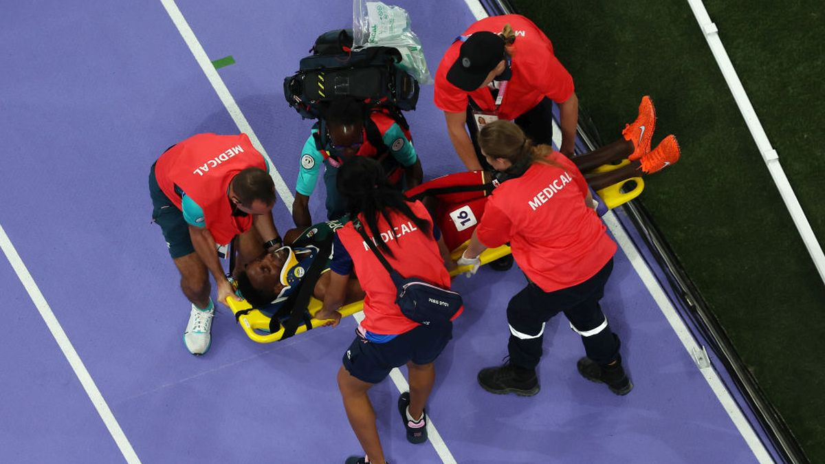 Lamecha Girma of Team Ethiopia lies on a stretcher and receives medical treatment after falling during the Men's 3000m Steeplechase Final. GETTY IMAGES