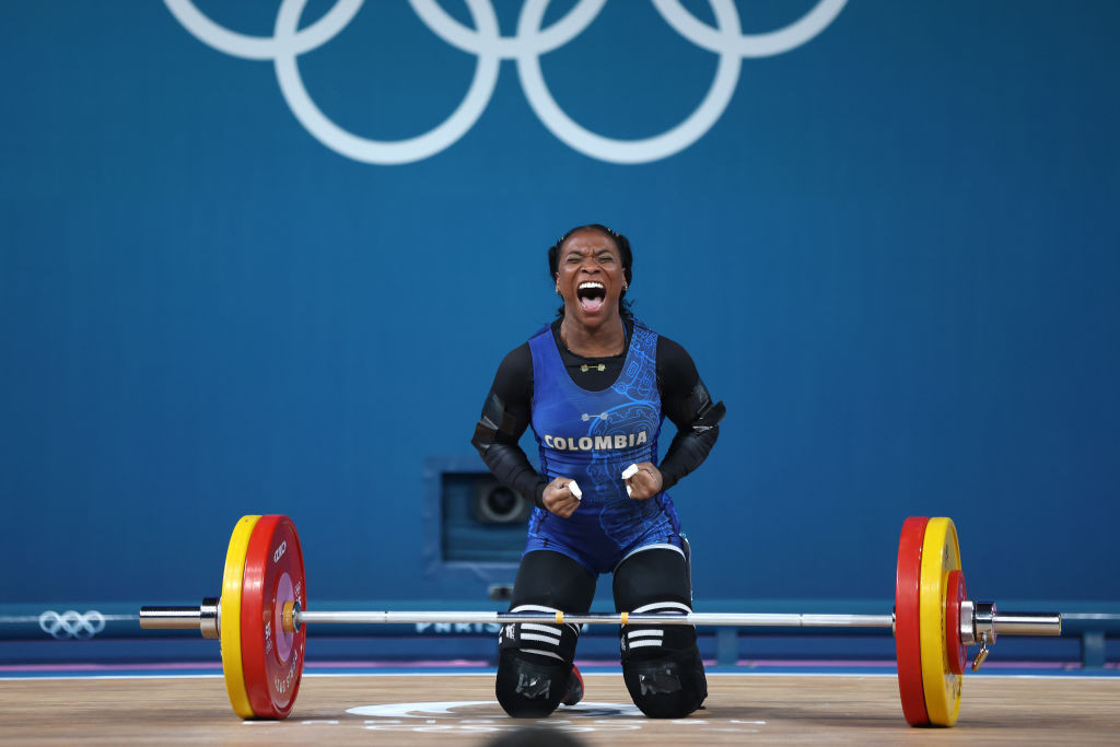 Yenny Alvarez of Team Colombia reacts while performing the snatch. GETTY IMAGES