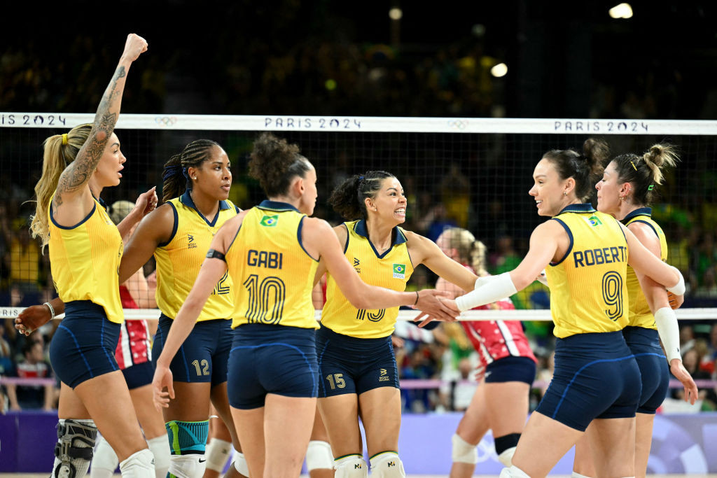 Brazil's team celebrates during the women's volleyball semi-final match. GETTY IMAGES