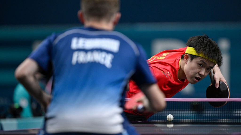 China's Wang Chuqin returns the ball to France's Alexis Lebrun during his men's table tennis singles match. GETTY IMAGES