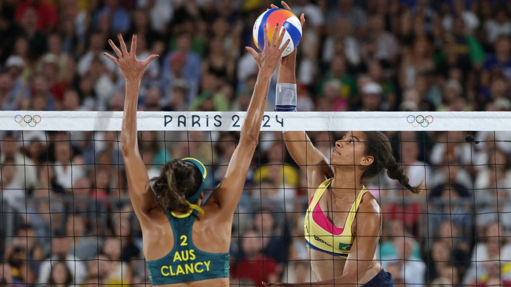 Ana Patricia Silva Ramos of Team Brazil attacks the net against Taliqua Clancy of Team Australia during the Women's semifinal. GETTY IMAGES