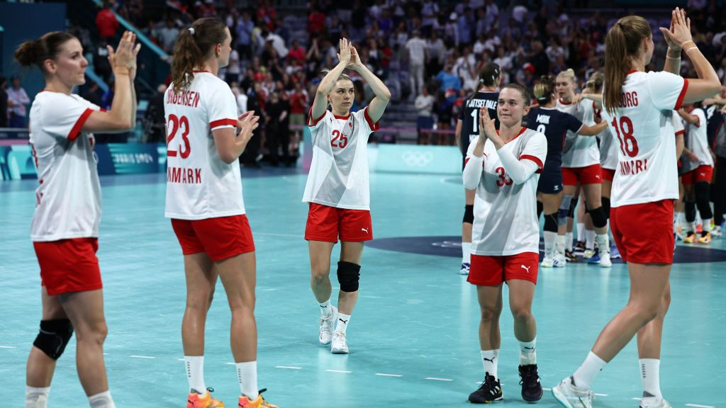 Trine Oestergaard (C), Denmark's left wing #33 Emma Friis (2ndR) and teammates react after being defeated by Norway. GETTY IMAGES