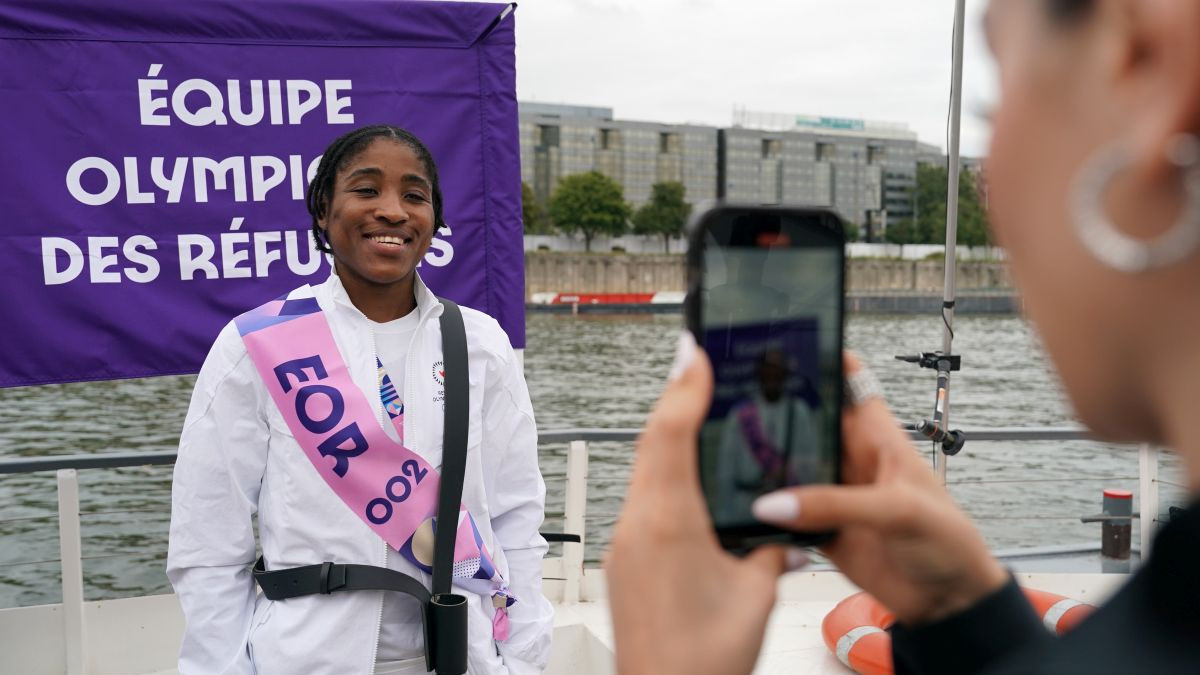 Ngamba of Refugee Team poses for a photo on a boat on the River Siene during the opening ceremony. GETTY IMAGES