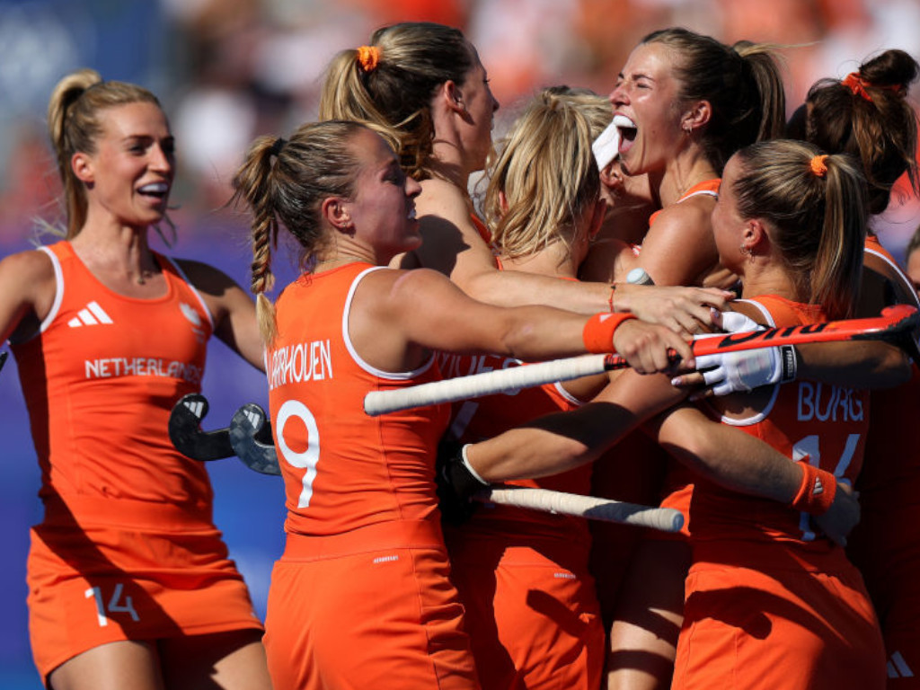 Team Netherlands (C) celebrates scoring her team's first goal with teammates during the Quarter Final Women's match getting images