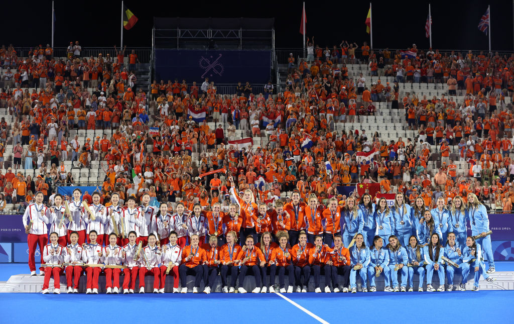 Gold medalists, Team Netherlands (C), Silver medalists, Team People's Republic of China (L) and Bronze medalists, Team Argentina (R) pose for a photo on the podium GETTY IMAGE