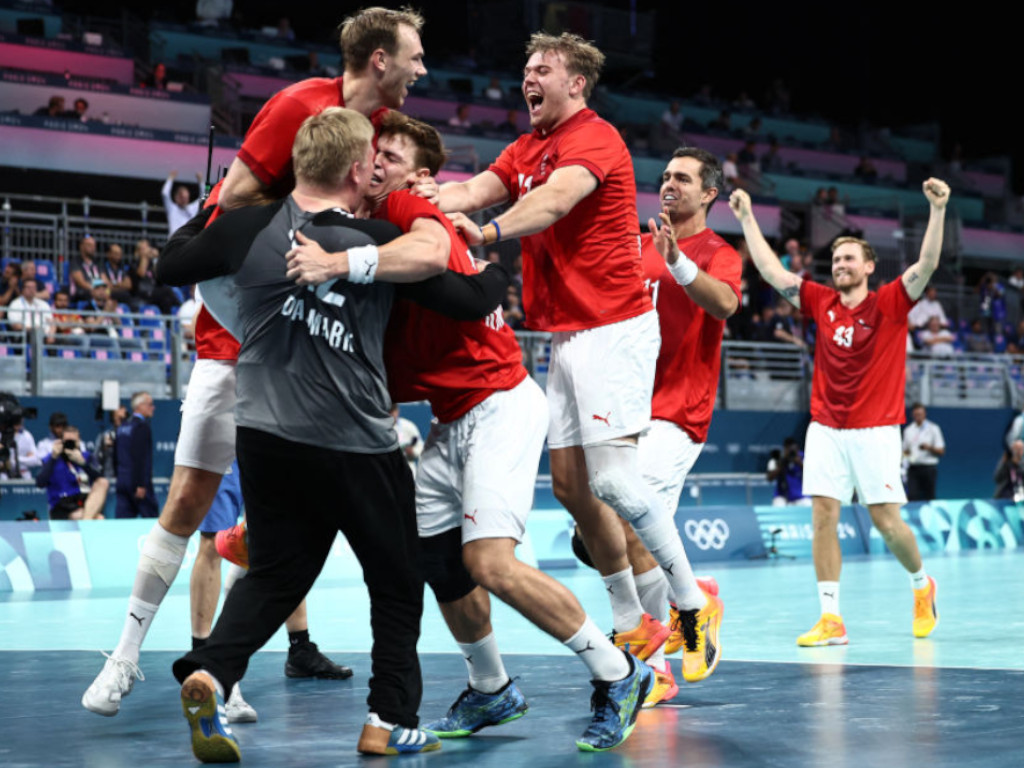 The Denmark handball team celebrate after winning the men's quarter-final handball match between Denmark and Sweden at the Paris 2024 Olympic Games. Getty Images