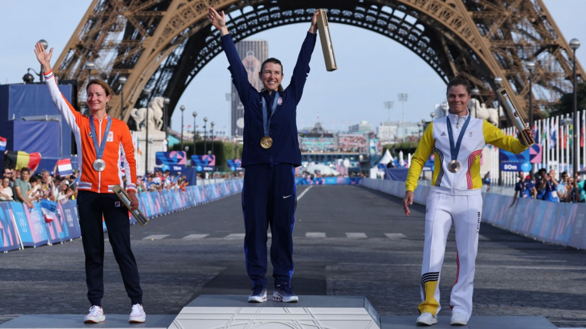 Women's road race podium: Faulkner, Vos, and Kopecky. GETTY IMAGES