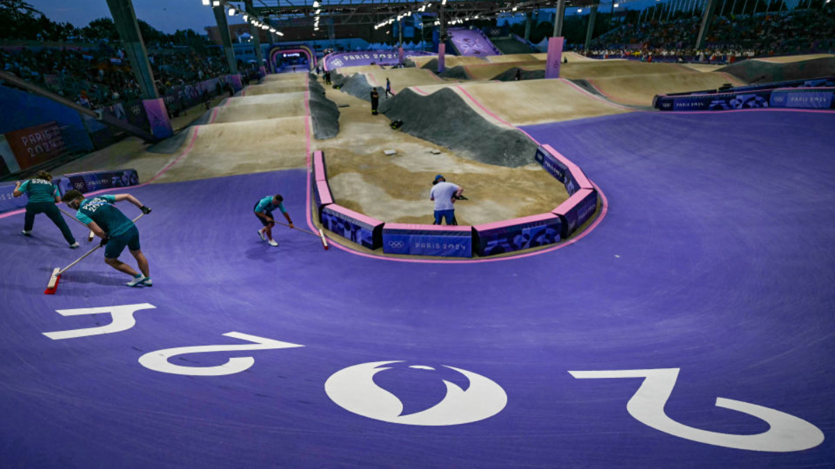 Volunteers prepare the track ahead of the Men's Cycling BMX Racing finals during the Paris 2024. GETTY IMAGES