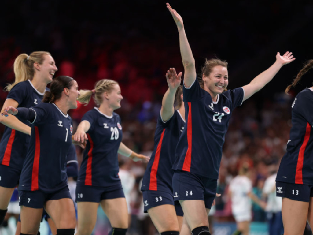 Sanna Solberg-Isaksen #24 of Team Norway celebrate after her team defeated Team France during the Women's Gold Medal match between Team Norway and Team France GETTY IMAGES