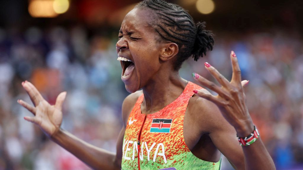 Faith Kipyegon of Team Kenya celebrates winning the Gold medal and setting a new Olympic record. GETTY IMAGES