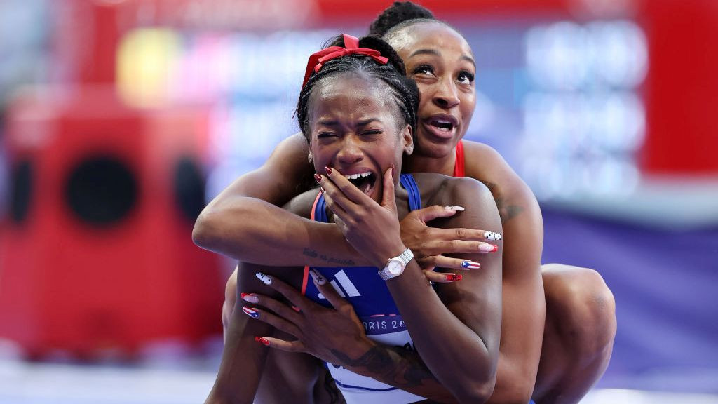  Bronze medalist Jasmine Camacho-Quinn of Team Puerto Rico consoles silver medalist Cyrena Samba-Mayela of Team France following the Women's 100m Hurdles Final. GETTY IMAGES