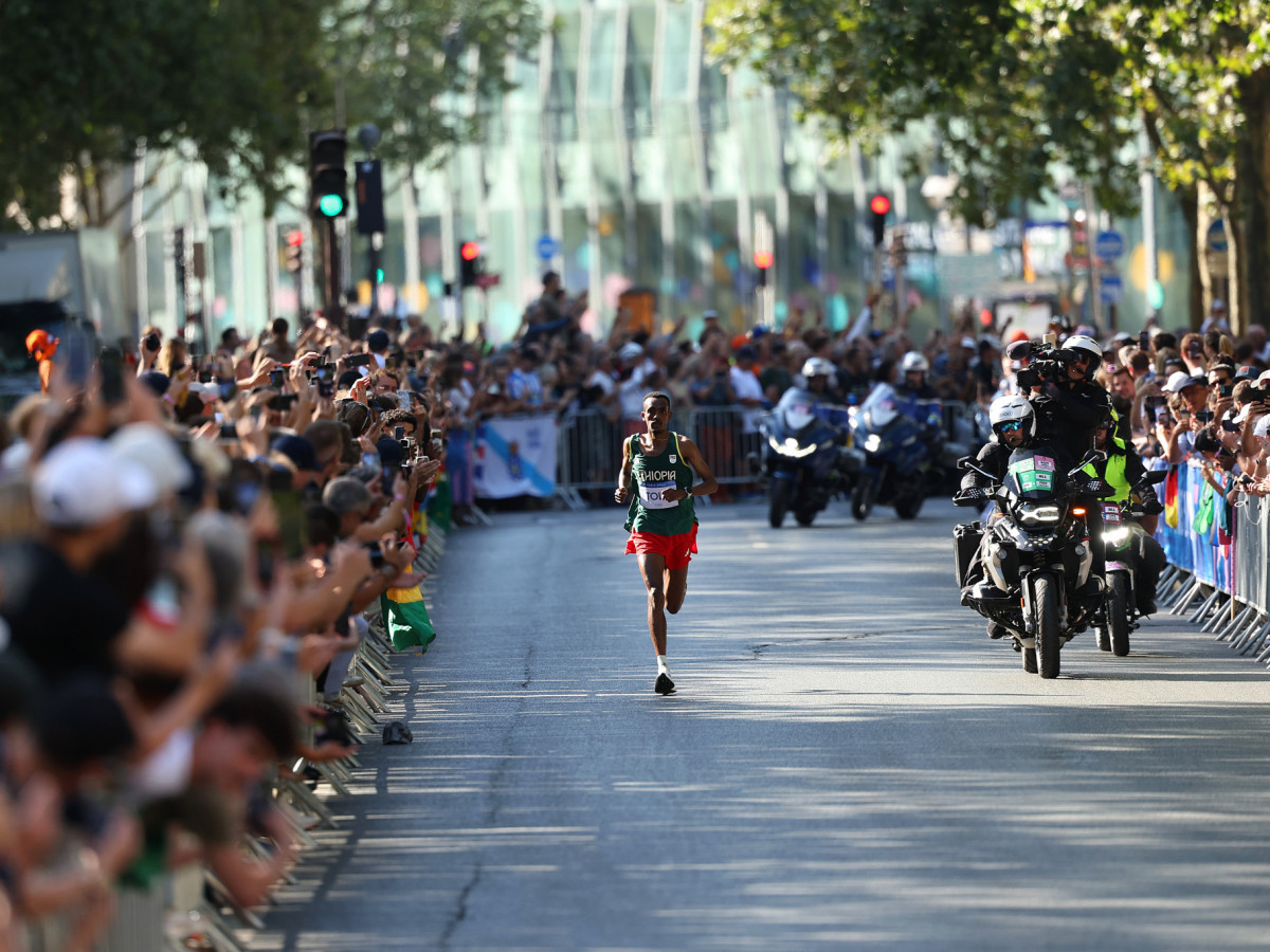 Tamirat Tola of Team Ethiopia runs through Paris during the Men's Marathon at the Paris 2024 Olympic Games. GETTY IMAGES