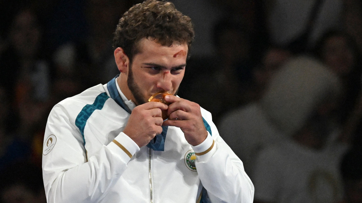 Uzbekistan's Razambek Jamalov with gold medal. GETTY IMAGES