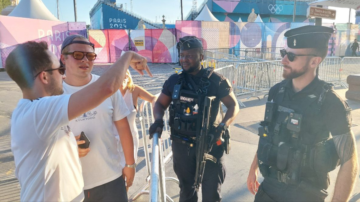 The police in Paris not only enforce security but also provide directions with a smile. RDP/INSIDE THE GAMES