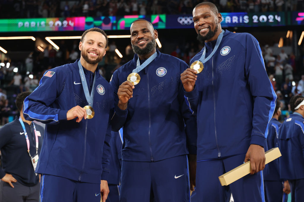 Stephen Curry, LeBron James, and Kevin Durant of Team United States pose for a photo during the Men's basketball medal ceremony on day fifteen of the Olympic Games Paris 2024 GETTY IMAGES