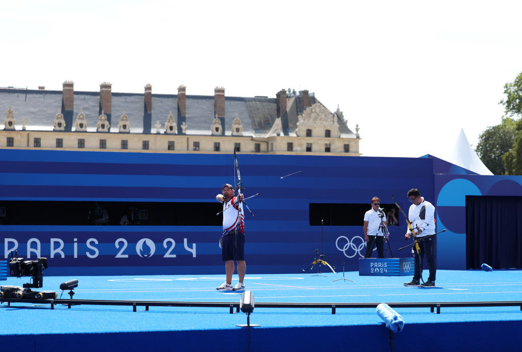 Kim Woojin and Brady Ellison in their thrilling gold medal match. GETTY IMAGES