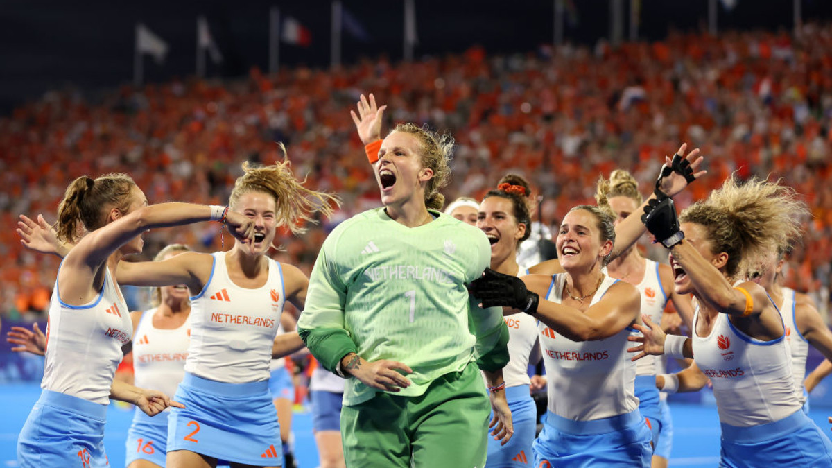 Anne Veenendaal of Team Netherlands celebrates with teammates following victory in the Women's Gold Medal match. GETTY IMAGES