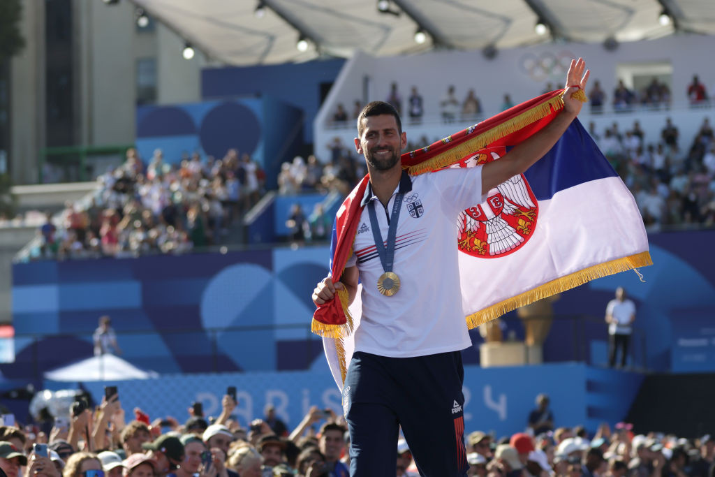 Novak Djokovic with his gold medal. GETTY IMAGES