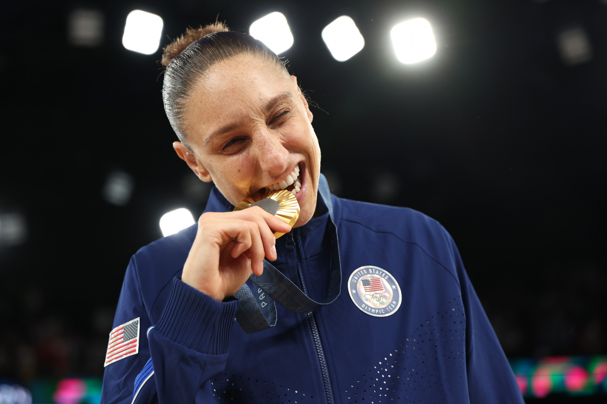 Gold medalist Diana Taurasi of Team United States bites her medal. GETTY IMAGES 