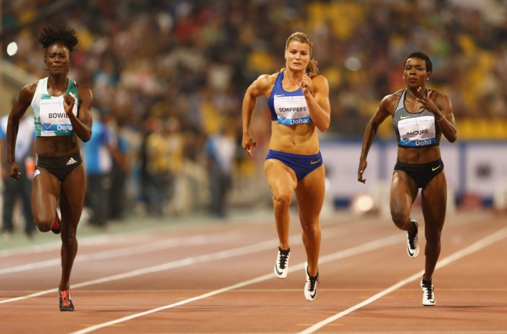 Dafne Schippers of the Netherlands (centre) had to settle for second in the Doha 100m despite running 10.83 as Tori Bowie of the United States (left) clocked 10.80 ©Getty Images