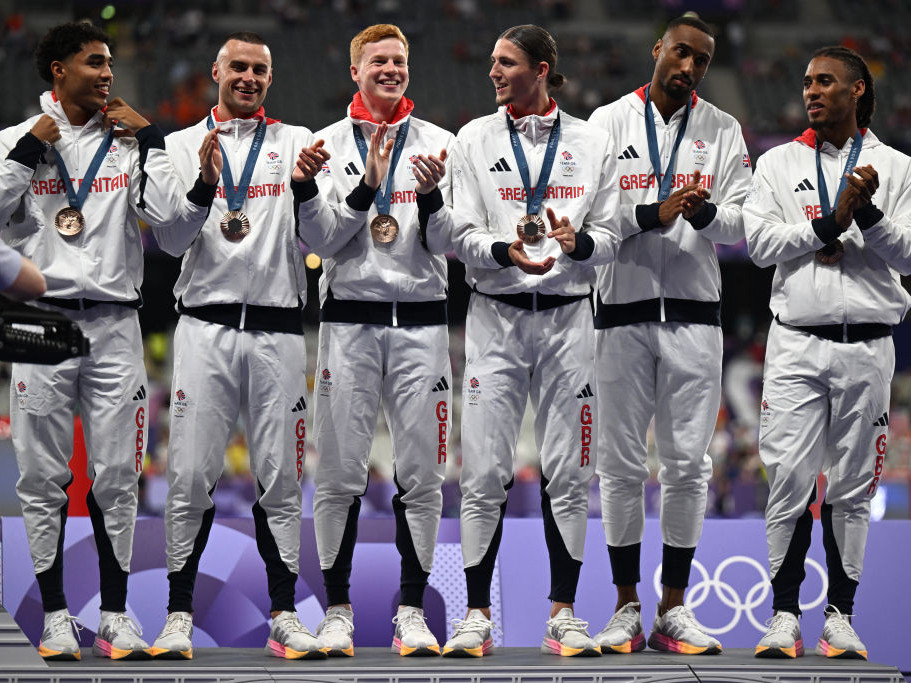 Sam Reardon, far left, joins Team GB at the podium. GETTY IMAGES