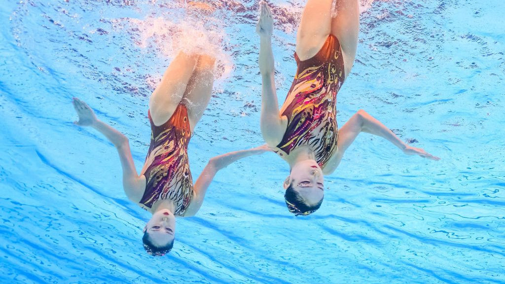 An underwater view shows China's Wang Liuyi and China's Wang Qianyi competing in the duet free routine of the artistic swimming even. GETTY IMAGES