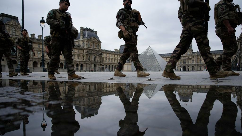 Security patrol in front of the Louvre Museum in Paris, France, ahead of the opening ceremony. GETTY IMAGES