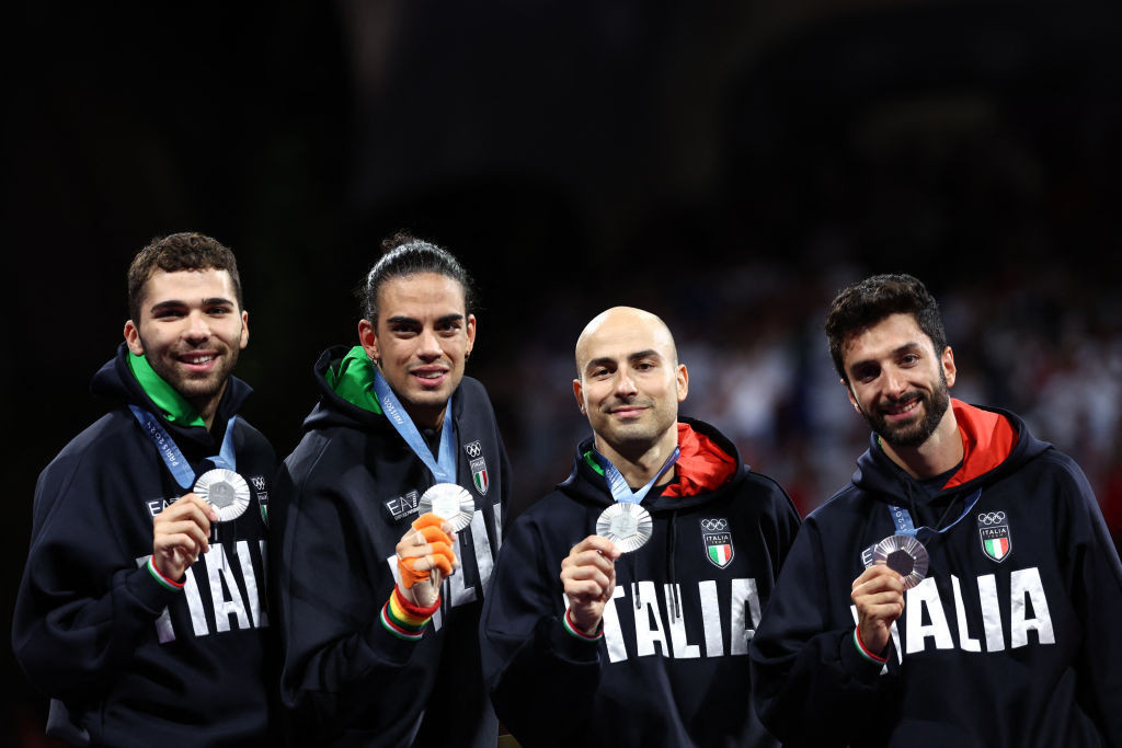 Silver medallists Italy's Filippo Macchi, Italy's Tommaso Marini, Italy's Alessio Foconi and Italy's Guillaume Bianchi celebrate on the podium GettyImages