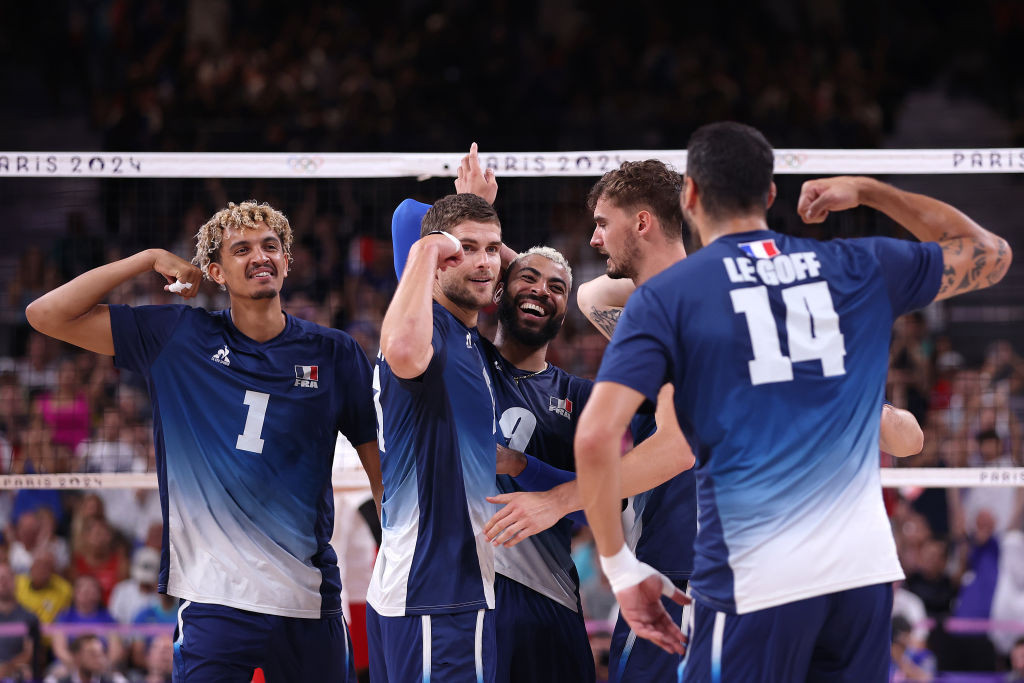 Trevor Clevenot #17 of Team France celebrates with teammates after scoring a point during the Men's Gold Medal Match. GETTY IMAGES