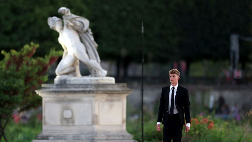 Leon Marchand of Team France prepares to carry the Olympic flame during the Closing Ceremony . GETTY IMAGES