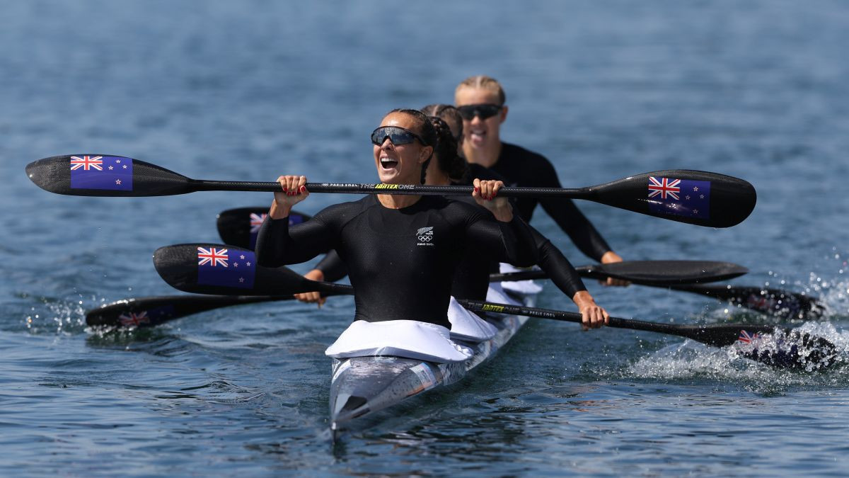 Lisa Carrington, Alicia Hoskin, Olivia Brett and Tara Vaughan celebrate winning the Gold medal. GETTY IMAGES