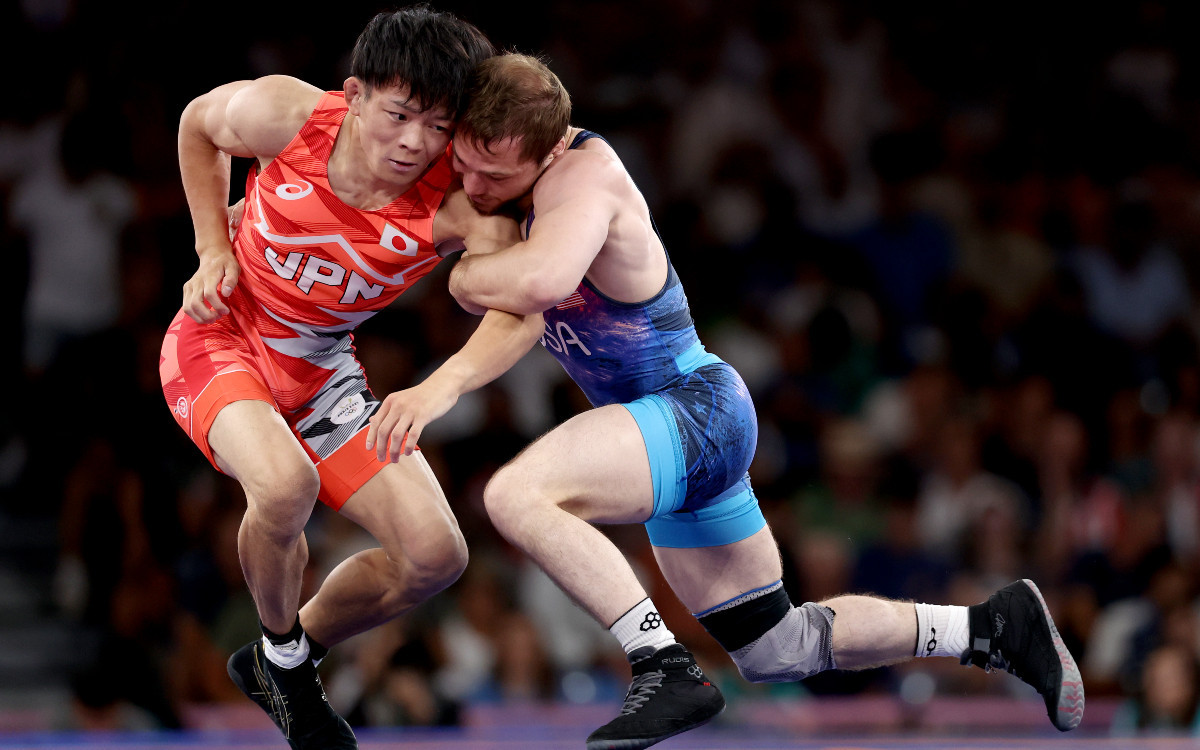 Rei Higuchi of Japan (red) against Spencer lee of USA during the final bout of the men's freestyle -57 kg category. GETTY IMAGES