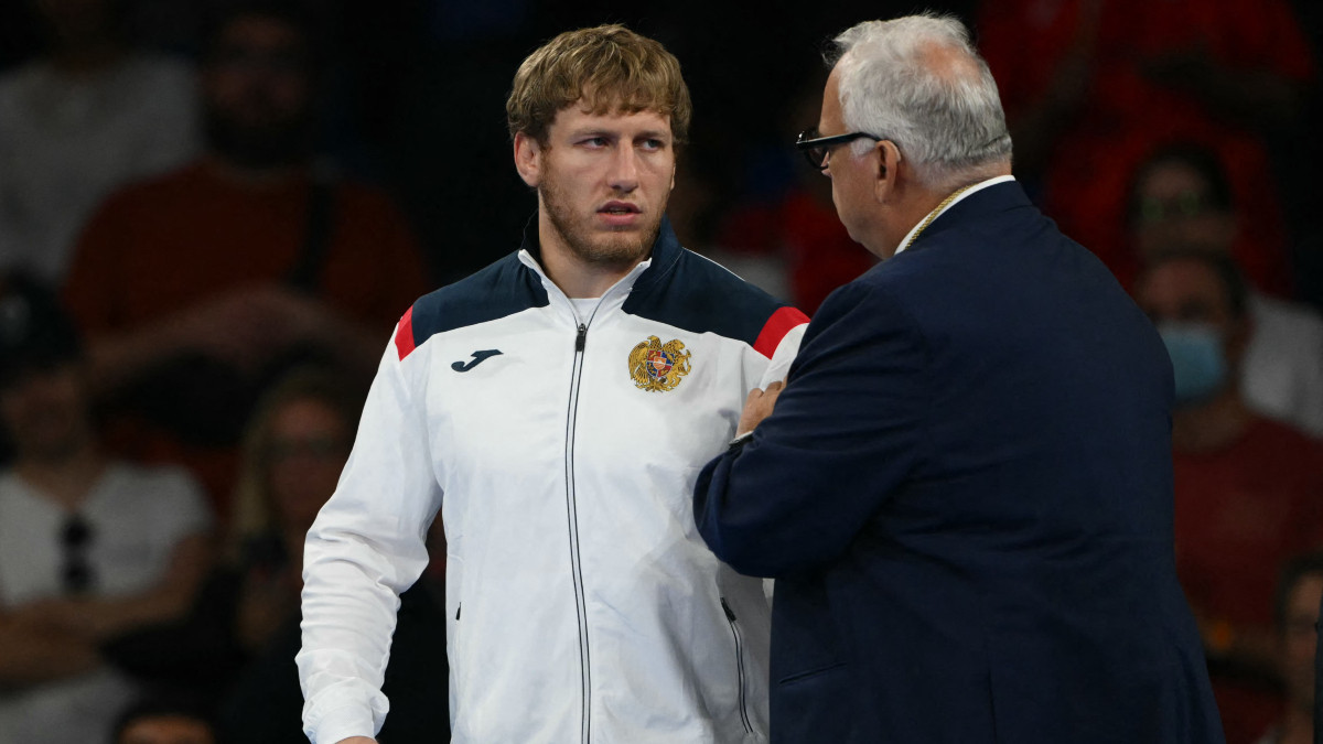 Artur Aleksanyan of Armenia (left) with UWW President Nenad Lalovic. GETTY IMAGES