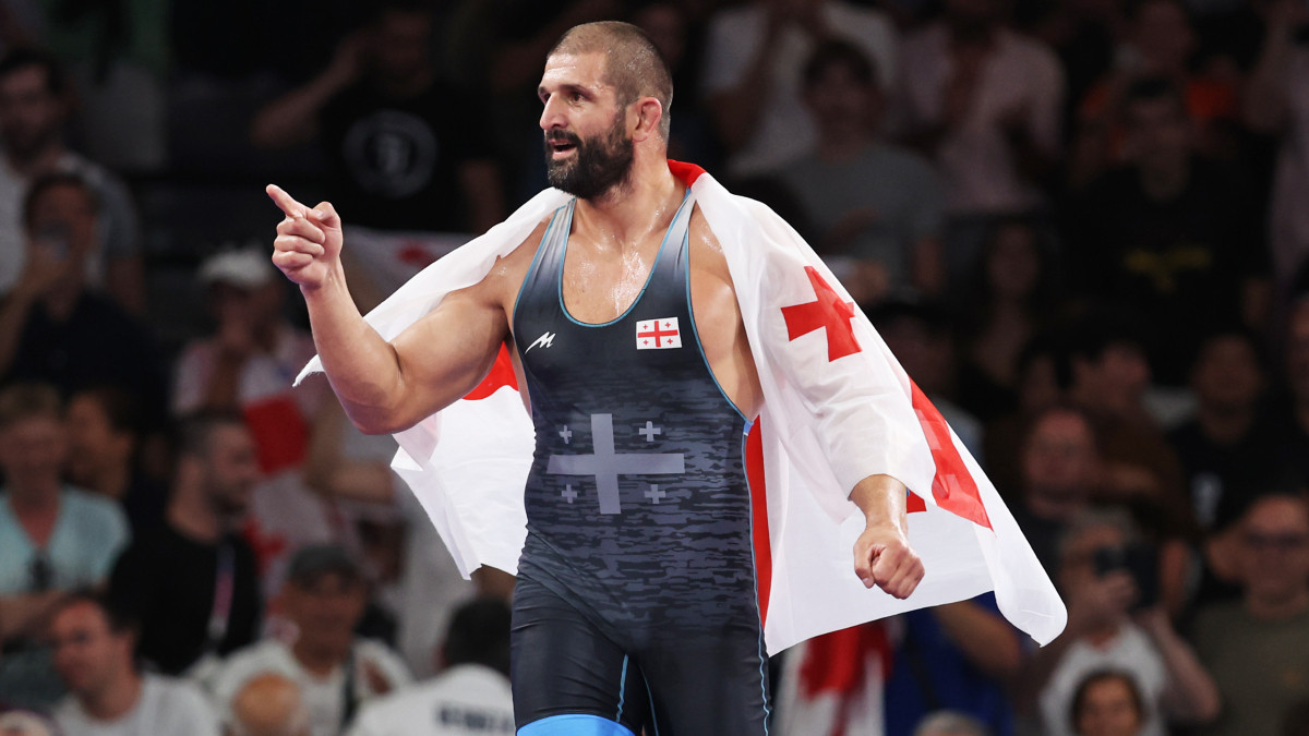 Geno Petriashvili with the Georgian flag. GETTY IMAGES