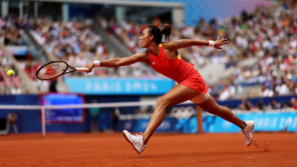 Qinwen Zheng of China plays a backhand during the Tennis Women's Singles Gold Medal match. GETTY IMAGES