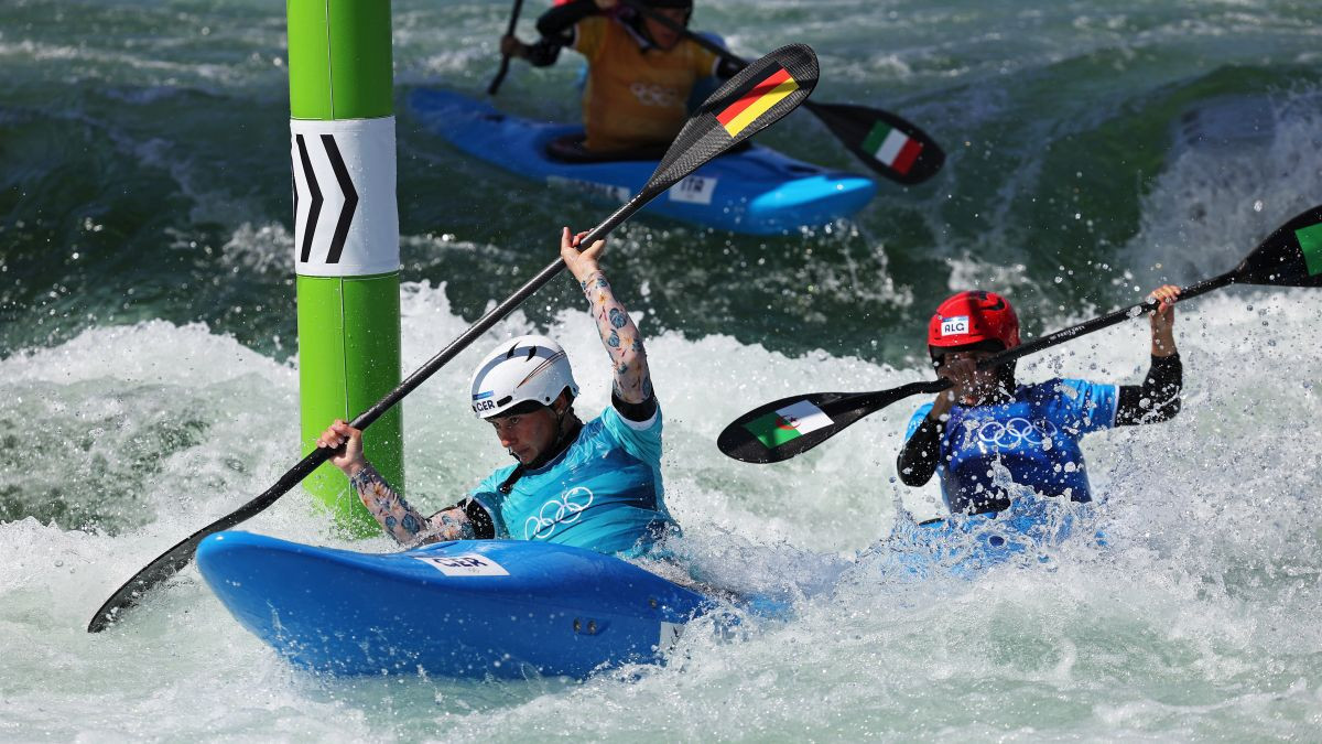 Participants in the Women's Kayak Cross race. GETTY IMAGES