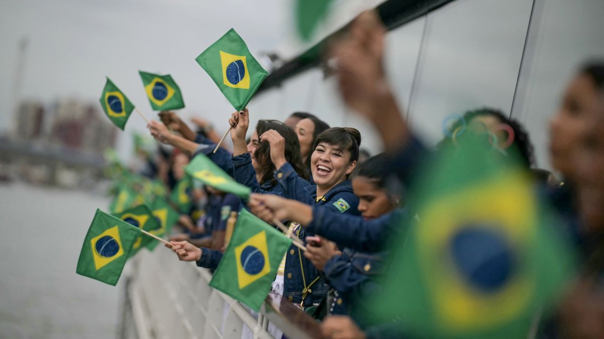 Athletes from the Brazilian delegation wave Brazilian flags at the Paris 2024 Opening Ceremony. GETTY IMAGES