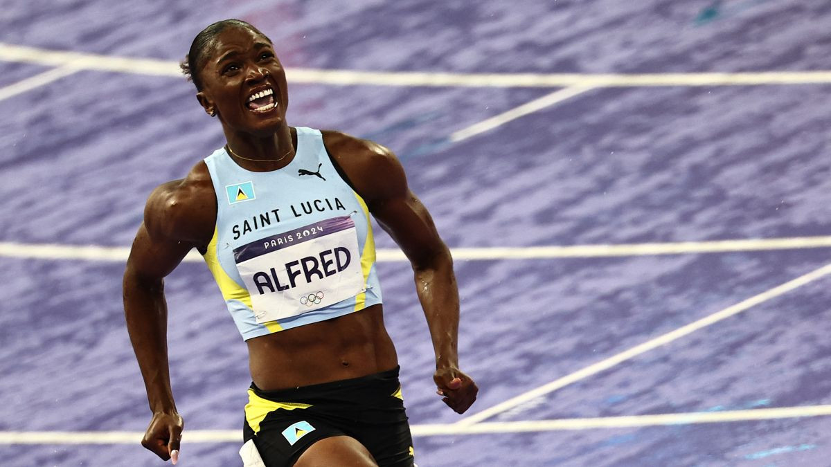 Julien Alfred celebrates winning the women's 100m final. GETTY IMAGES