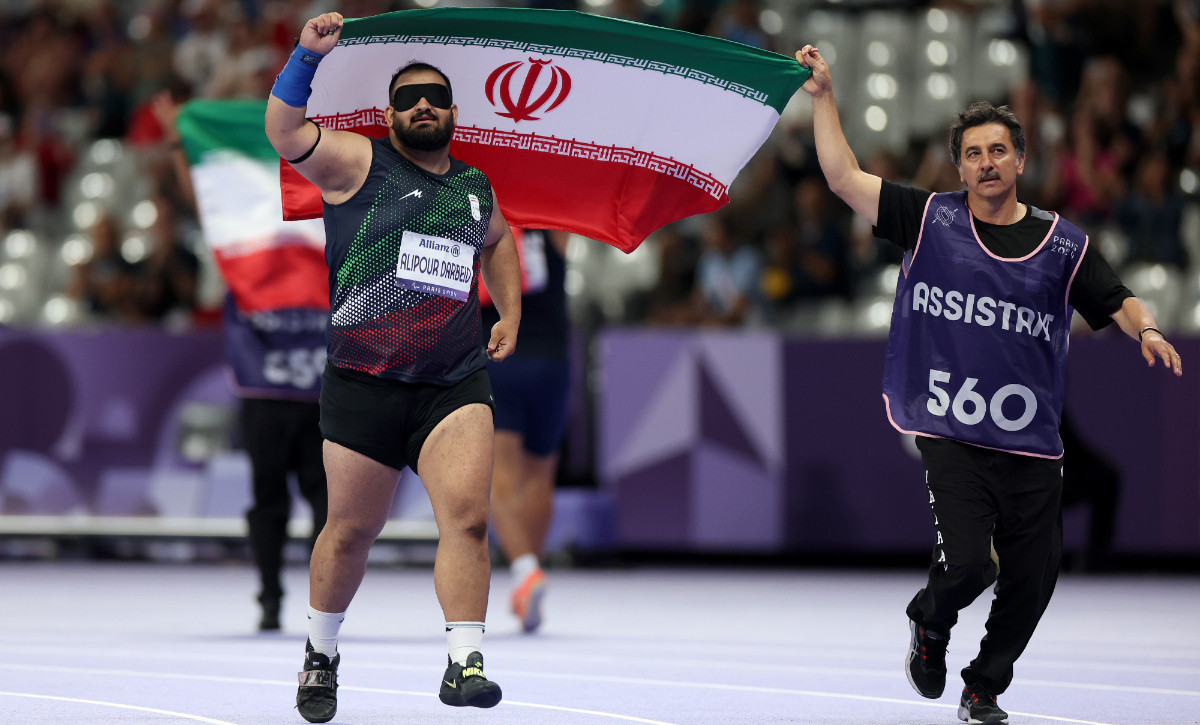 Iran's Amirhossein Alipour Darbeid celebrates his gold medal in the men's shot put - F11. GETTY IMAGES