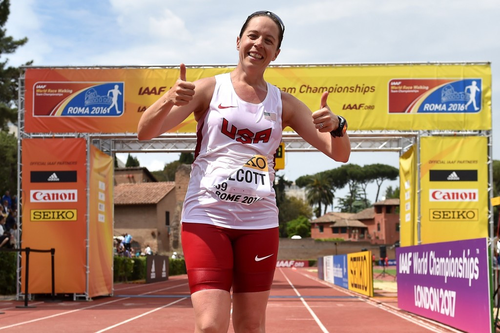 Erin Talcott of the United States celebrates at the finish line after becoming the first woman to race against men in the 50km event in the history of the Championships