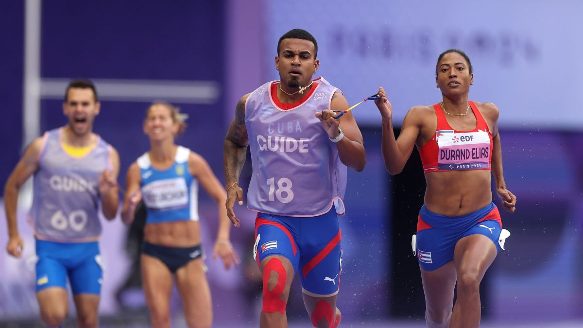 Durand Elias, and guide Yuniol Kindelan compete during the Women's 400m T12 Final. GETTY IMAGES